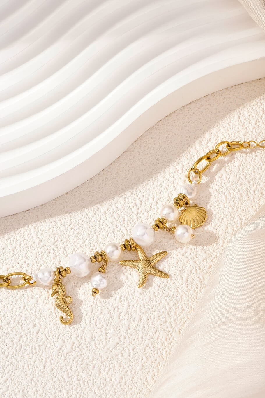 Gouden parel/zeester armband